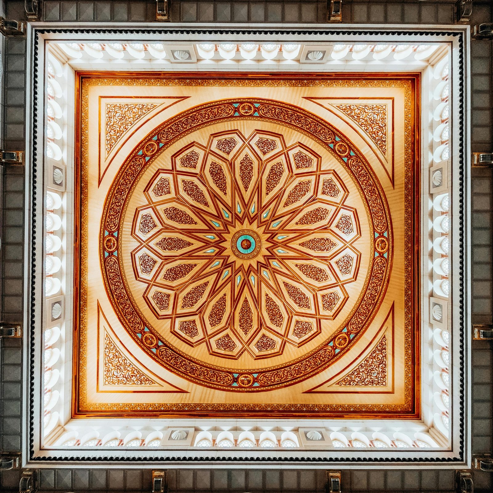 Ornate geometric design on a mosque ceiling showcasing Islamic art patterns.